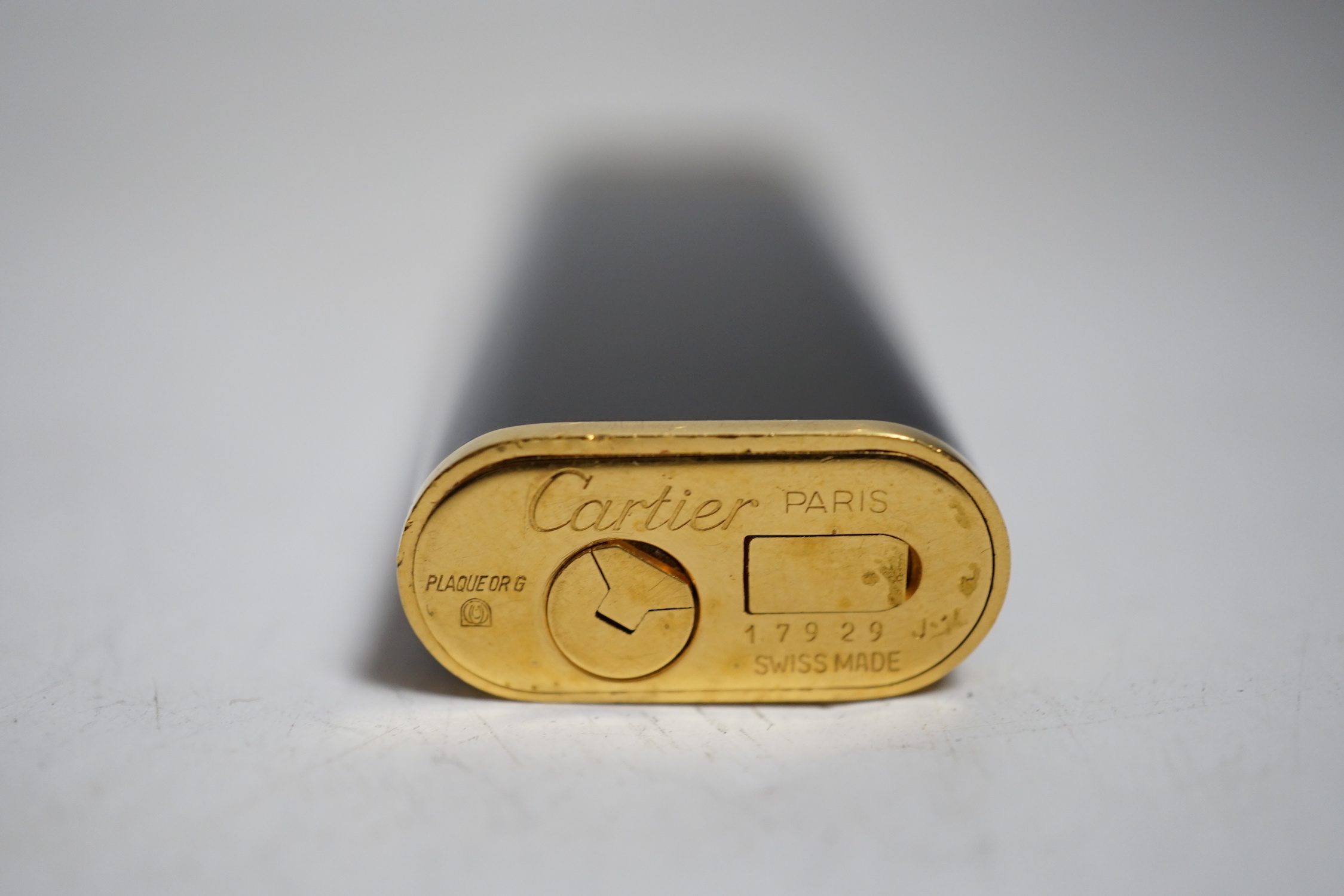 Cartier, black enamel and gold plated lighter